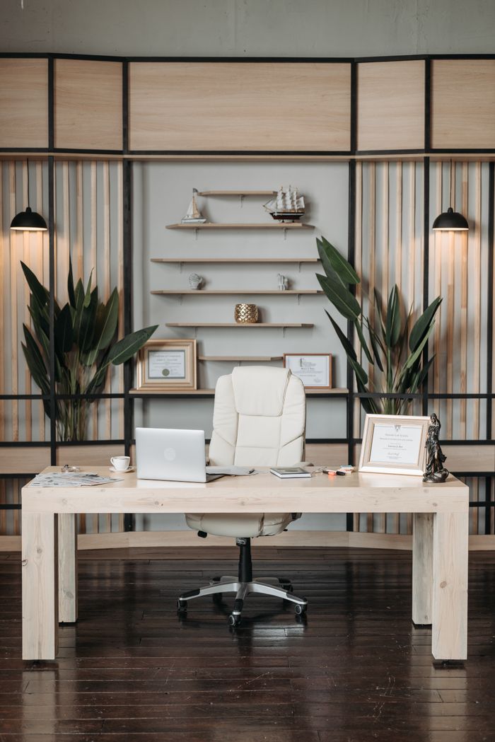 about-us Elegant home office featuring a sleek desk, comfortable armchair, and stylish decor setup.
